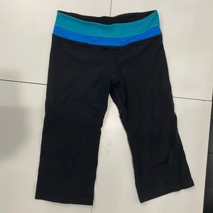 Short black Lululemon leggings with blue rim